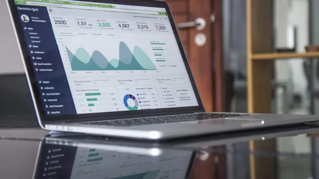 Business planning with laptop and charts