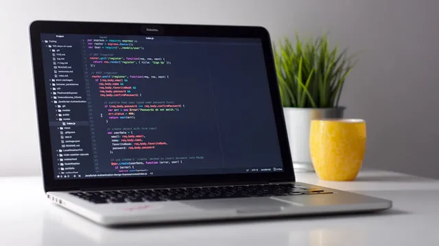 Developer maintaining code on laptop