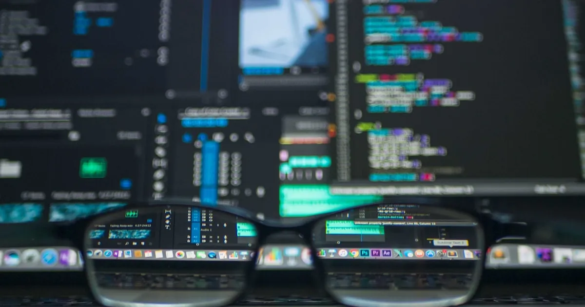 CSS code and design tools on a developer desk