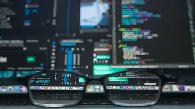 CSS code and design tools on a developer desk